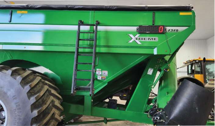 LED scoreboard display on the side of a grain cart